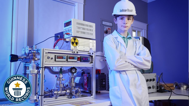 Jackson Oswalt next to his fusion reactor